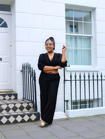 Trendy V-Neck Crop Top and Wide-Leg Pants Two-Piece Set with Minimalist Design