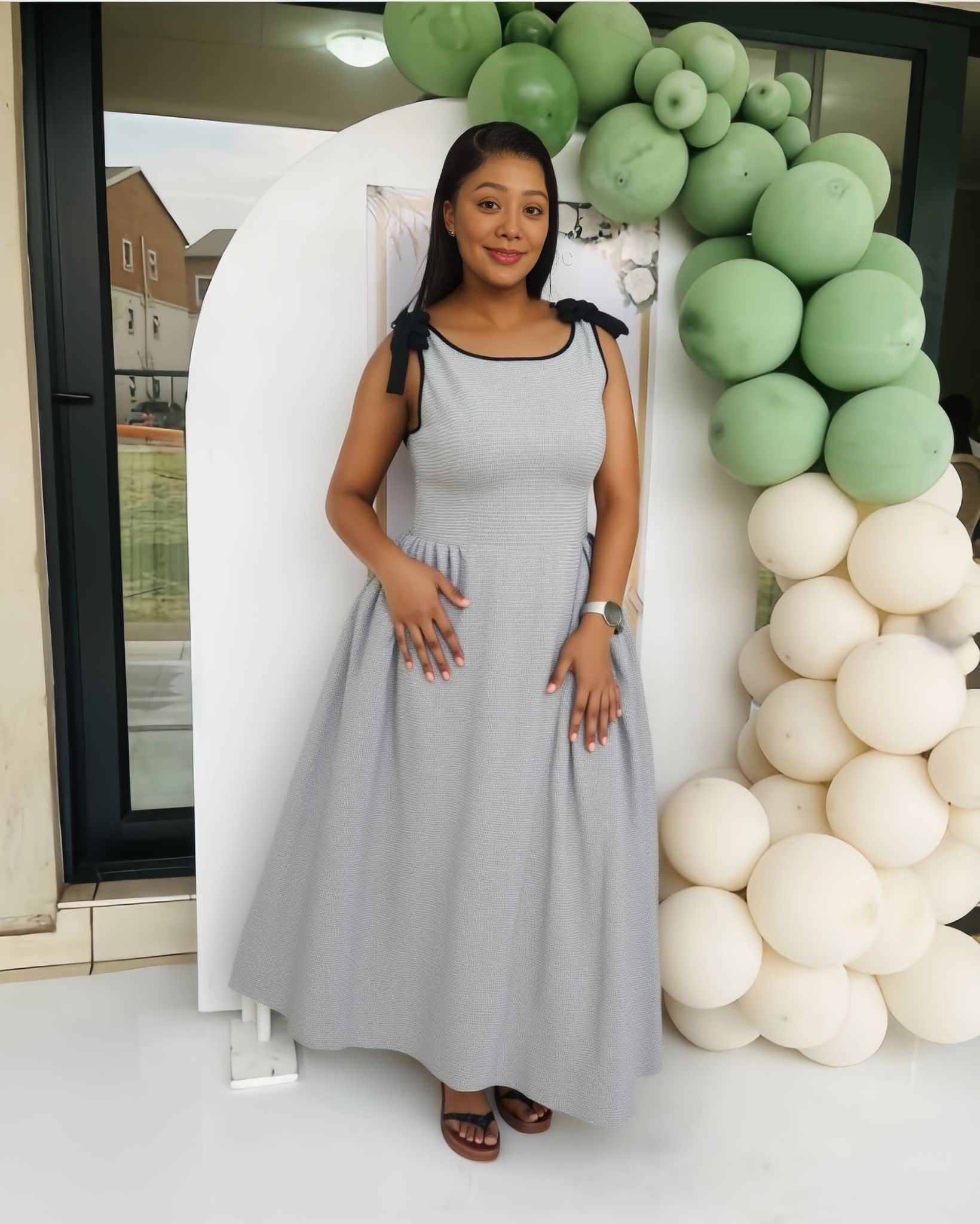 Fit-and-Flare Sleeveless Dress with Structured Pleats and Contrast Shoulder Ties