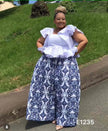 Ornate navy-and-white patterned wide-leg pants, ankle-length