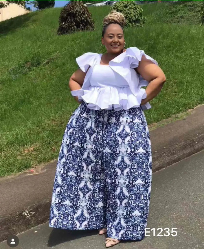 Ornate navy-and-white patterned wide-leg pants, ankle-length