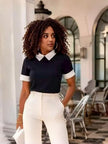 Women’s knit top with white contrast collar and short sleeves, dark navy