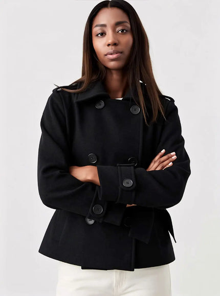 Women's short black double-breasted collared coat with buttons and flap pockets