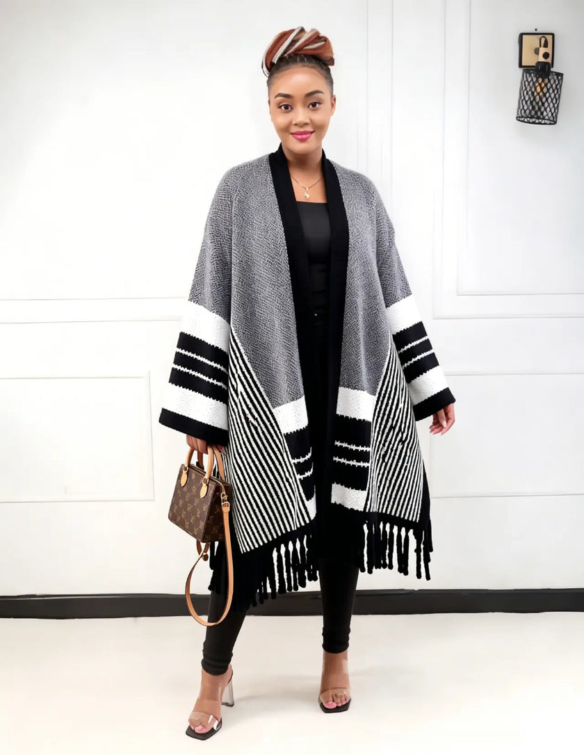 Striped knit cardigan with fringe hem, open front; dark and light sleeves