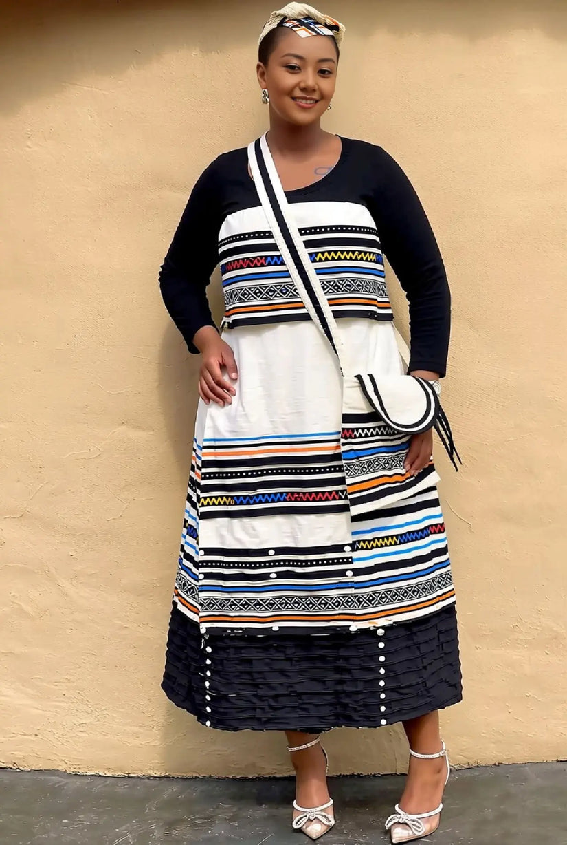 African maxi skirt set with striped geometric pinafore-style dress and black tiered skirt