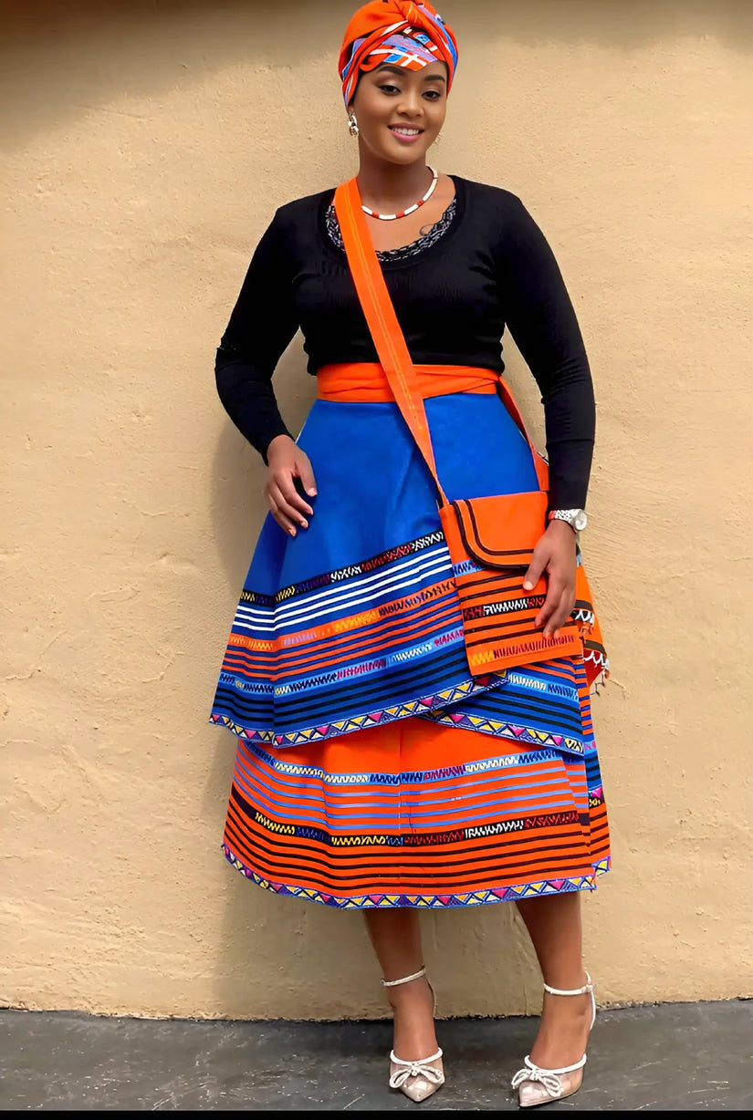 Layered geometric stripe skirt in blue and orange with wide tiered hem.