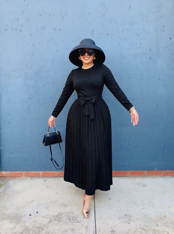 Women knit maxi dress in black, crew neck, long sleeves, pleated skirt, waist tie