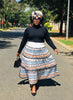 Striped African maxi skirt set with long-sleeve black top, white orange blue striped skirt