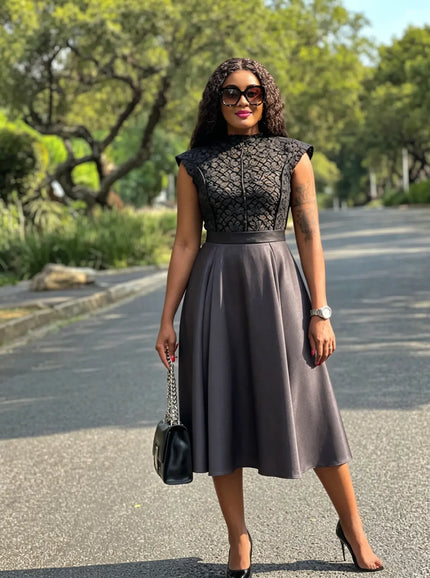 Black sleeveless embroidered midi dress with high neckline, flared A-line skirt