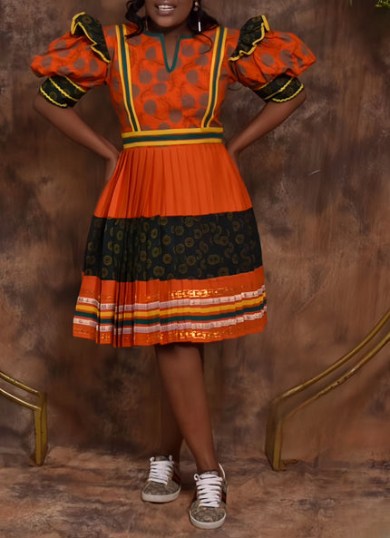 Orange and black polka dot puff-sleeve midi dress with tiered skirt