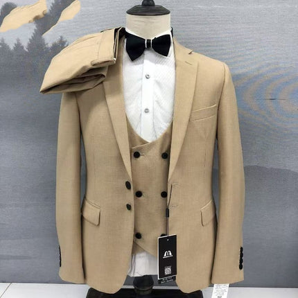 Khaki 3-piece suit on mannequin: peak lapel blazer, double-breasted vest, trousers