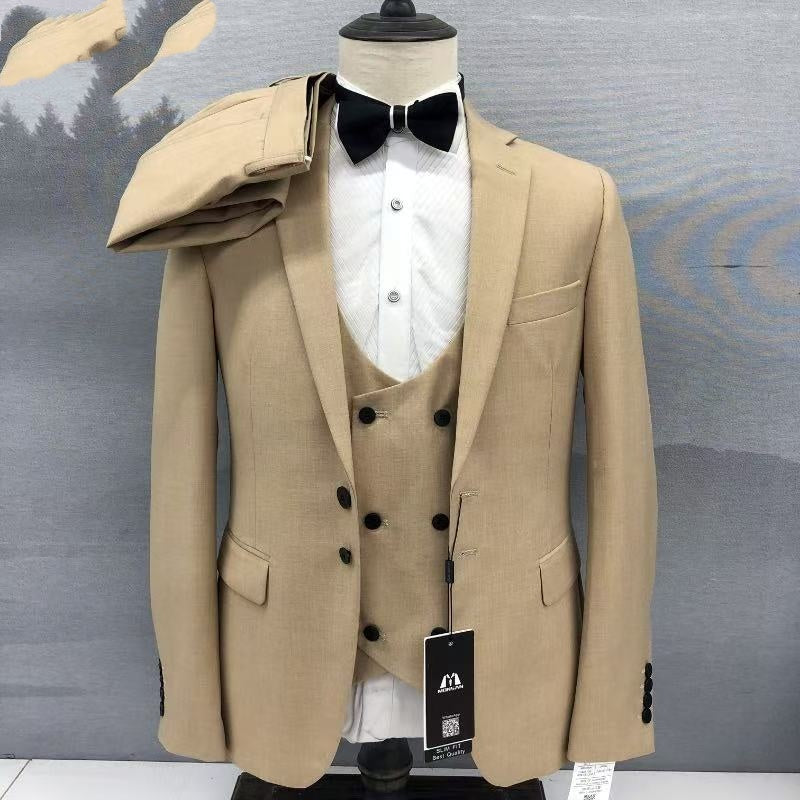 Khaki 3-piece suit on mannequin: peak lapel blazer, double-breasted vest, trousers