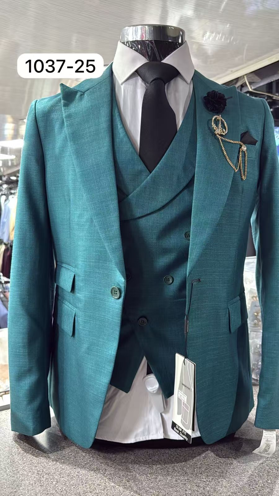 Teal slim-fit 3-piece suit with peak lapel jacket, vest, white shirt, black tie