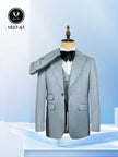 Light grey blue slim fit suit with peak lapels, waistcoat, and black bow tie
