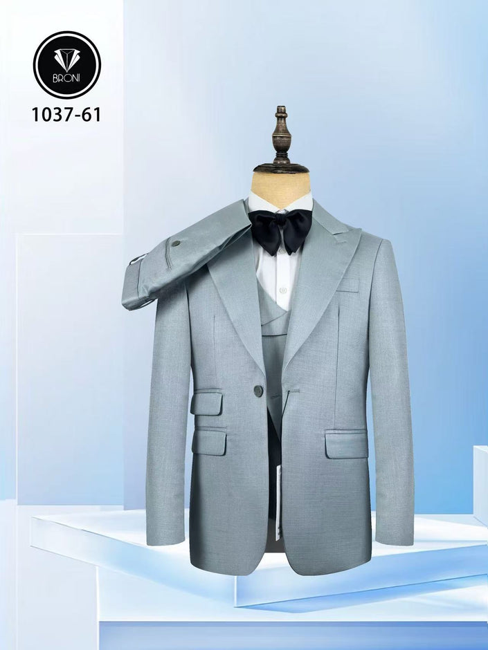 Light grey blue slim fit suit with peak lapels, waistcoat, and black bow tie