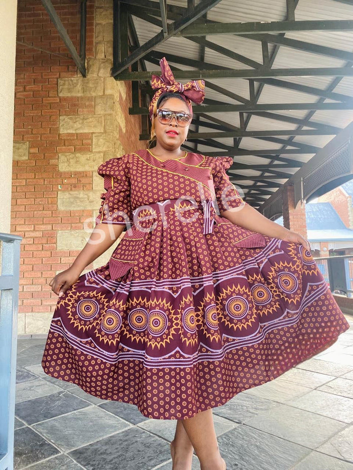 Brown tiered midi dress with puff sleeves, rounded geometric print, A-line skirt
