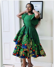 Green African print midi dress with ruffled puff sleeves and tiered skirt hem