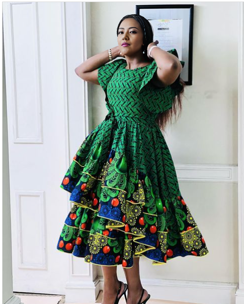 Green African print midi dress with ruffled puff sleeves and tiered skirt hem