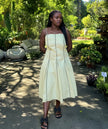 A-line midi dress in light beige with vertical piping detail, square neckline and straps
