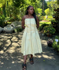 A-line midi dress in light beige with vertical piping detail, square neckline and straps