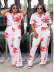 Floral twin set: short-sleeve button top and matching ankle-length pants, white with red prints