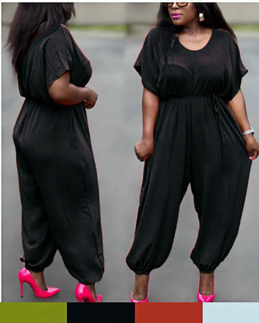 Black cinched-waist jumpsuit with drawstring and loose wide legs at ankle cuffs