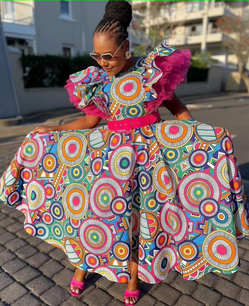 Traditional Circular Pattern Decorated Dress with Cinched Waist and Mid-Calf Design