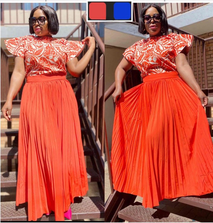 Pleated maxi skirt and puff-sleeve top set, orange-red with white patterned yoke