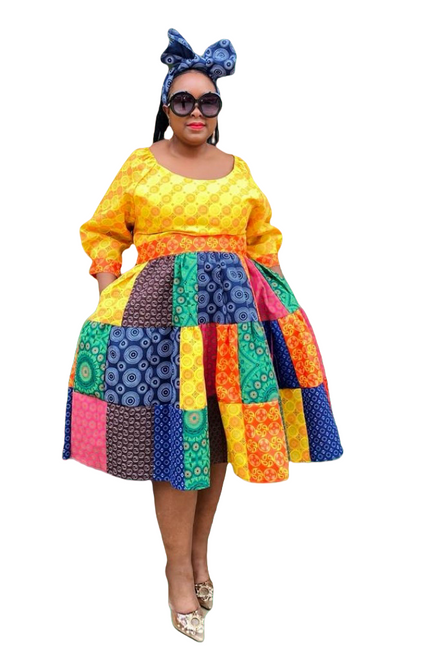 Patchwork midi dress in yellow, green, blue and orange geometric prints, gathered waist.