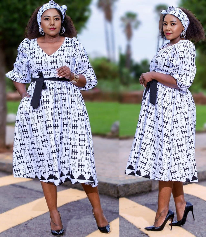 A-line midi dress with heritage print, short sleeves, V-neck, and waist belt