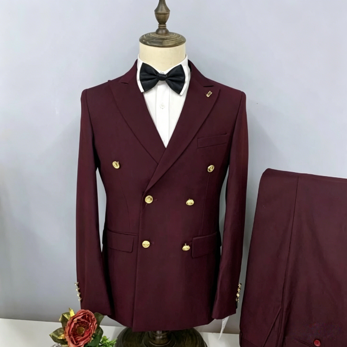 Burgundy double-breasted suit jacket with peak lapels, gold buttons, worn with bow tie and shirt