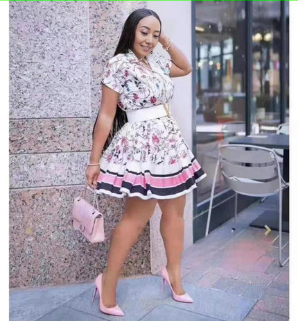 Floral ruffle mini dress with cinched waist, short puff sleeves, striped hem