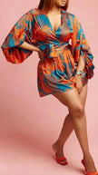 Printed mini dress with puff sleeves, V-neck wrap style and waist tie