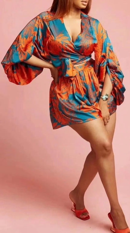 Printed mini dress with puff sleeves, V-neck wrap style and waist tie