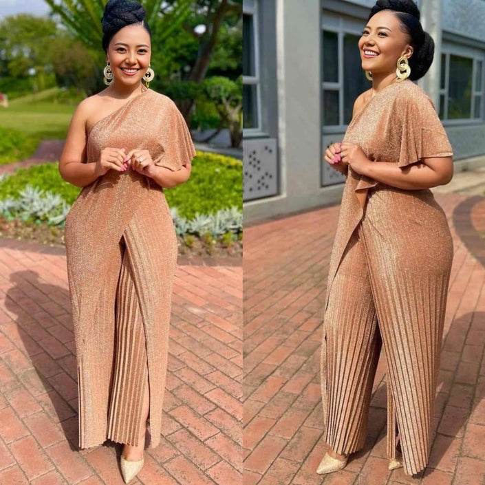 Gold one-shoulder pleated jumpsuit with wide legs and high slit