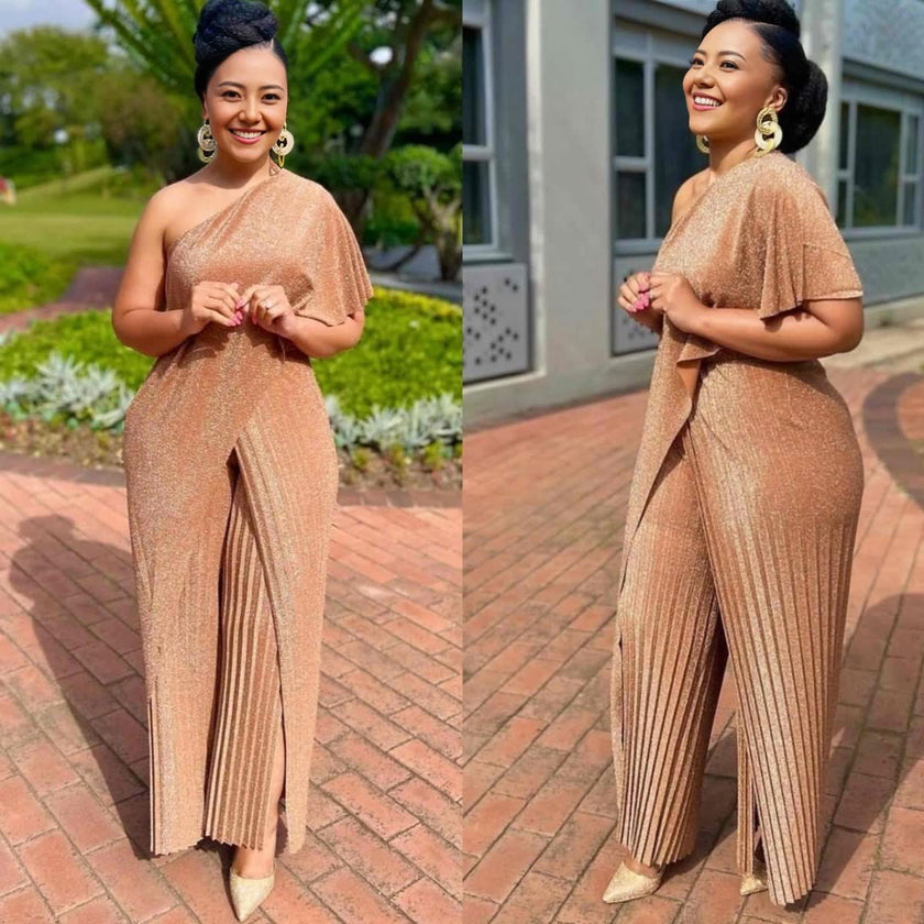 Gold one-shoulder pleated jumpsuit with wide legs and high slit