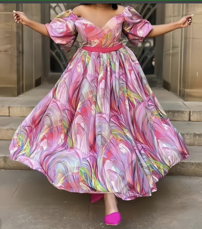 Pink puff-sleeve maxi dress with colorful abstract print and gathered full skirt