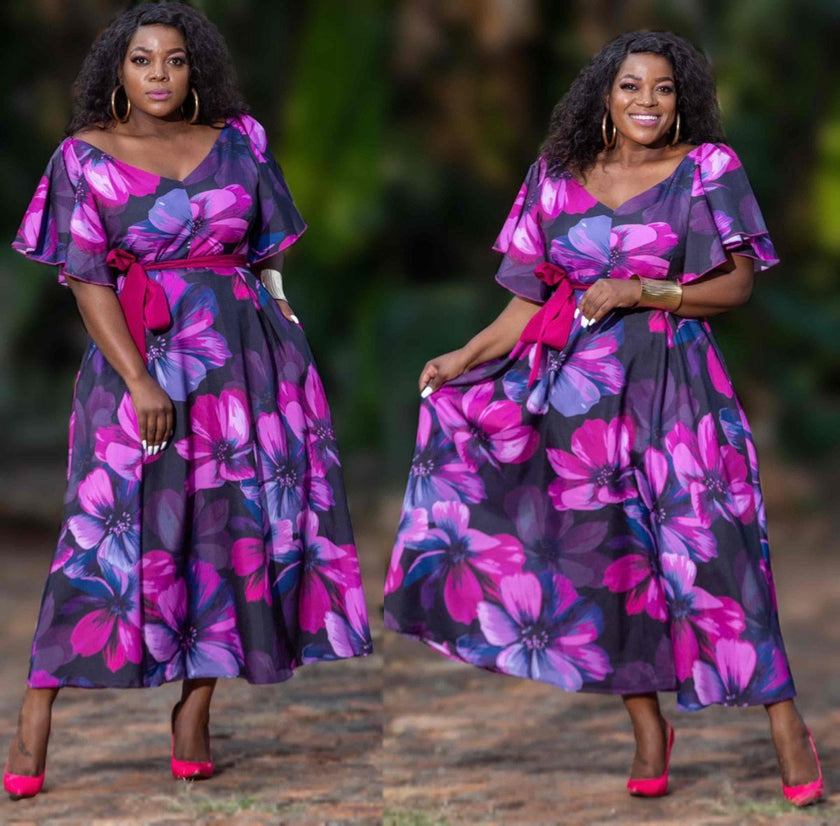 Floral maxi dress with puff sleeves, V-neck, and waist tie belt in magenta and purple