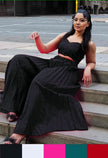 Black square-neck pleated top with matching tiered skirt