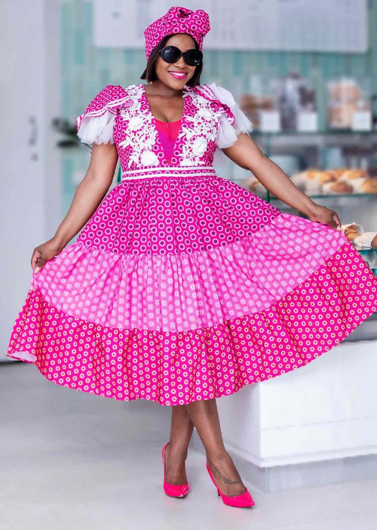Traditional Puff-Sleeve Dress with Circular Patterns and Lace Trim