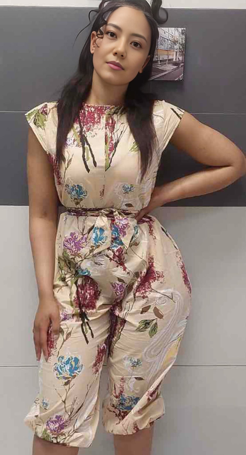 Cream floral sleeveless jumpsuit with gathered waist tie and straight neckline