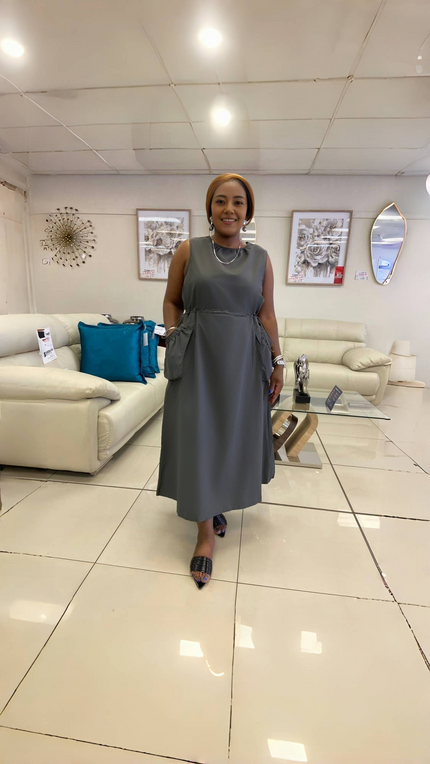 Grey sleeveless midi pocket dress with round neckline and loose, straight silhouette