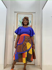 Blue puff-sleeve midi dress with colorful patchwork waistband and skirt