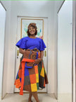 Blue puff-sleeve midi dress with multicolor patchwork skirt and patterned brown blocks