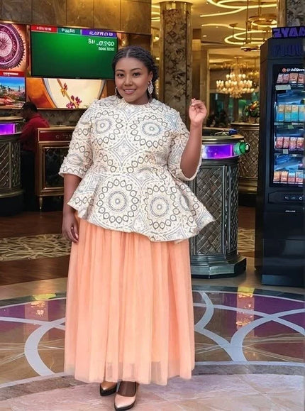 Plus-size geometric lace top with long sleeves and peach tulle skirt, flared hem