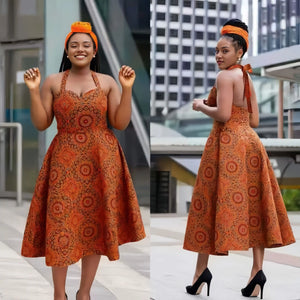 Orange patterned sleeveless flared midi dress with tied straps