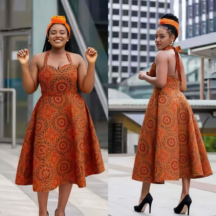 Orange patterned sleeveless flared midi dress with tied straps