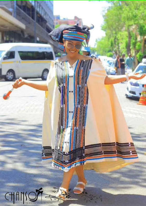 Embroidered cape dress with striped paneling and button front, light base