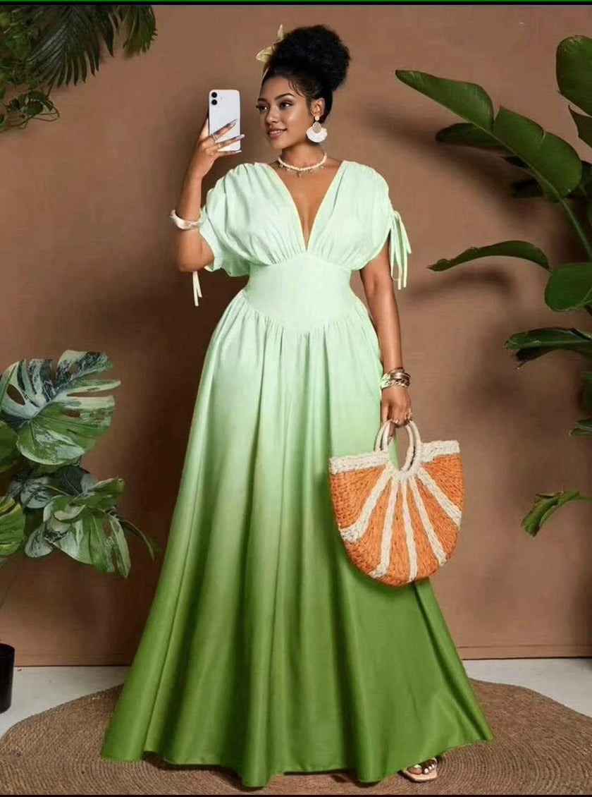 Green maxi dress with deep V neckline and tie sleeves, gathered waist