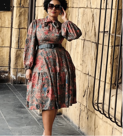 Abstract print midi dress with long puff sleeves and gathered skirt, includes belt