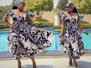 Navy floral midi dress with ruffle puff sleeves and gathered skirt